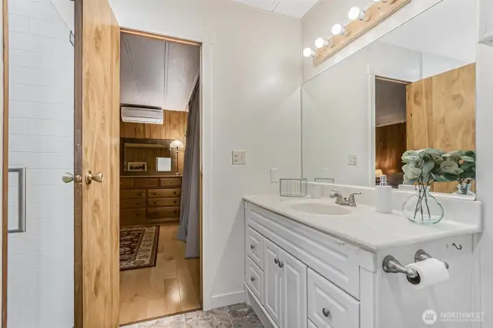 Primary bathroom features a walk-in shower behind the door. Primary bathroom features a walk-in shower behind the door.