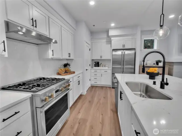 Dream kitchen boosts designated area for a coffee bar adjacent to the pantry. Photo is of model home-Victorian plan-elements of the Chateau plan can vary