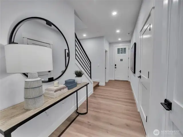 Welcoming entry hall showcases 9ft. ceilings-photo is of model home-Victorian plan-elements of the Chateau plan can vary