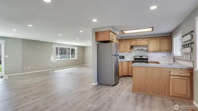 Open concept floor plan with large great room offering sight lines to the dining room, just off the kitchen.