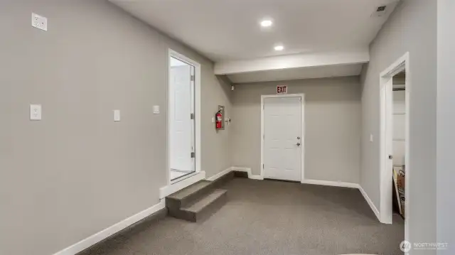Part of the garage was converted into this space, ideal for additional storage, conference room, play space, gaming area, etc.