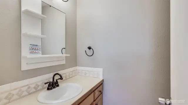 Convenient 1/2 bathroom great for guests.