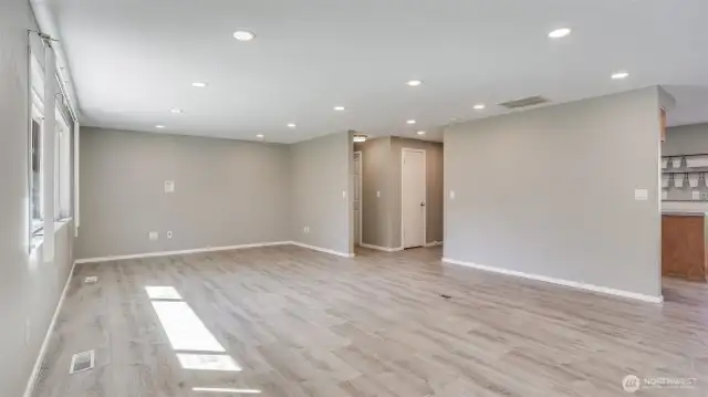 This great room flows seamlessly to other parts of the home with modern LVP floors flowing throughout.