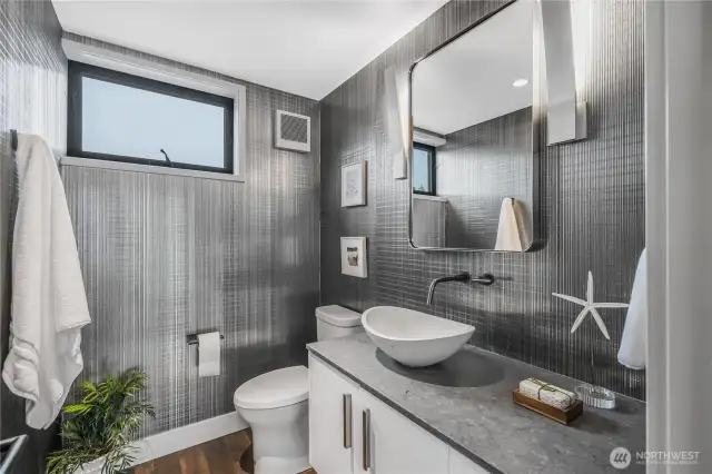 Upper level half bath with radiant heated floors.