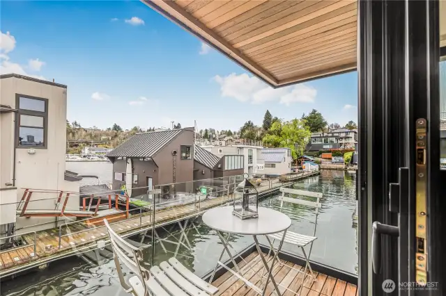 Private balcony deck off of third bedroom is covered and has peaceful views back into the channel and towards the yacht club.