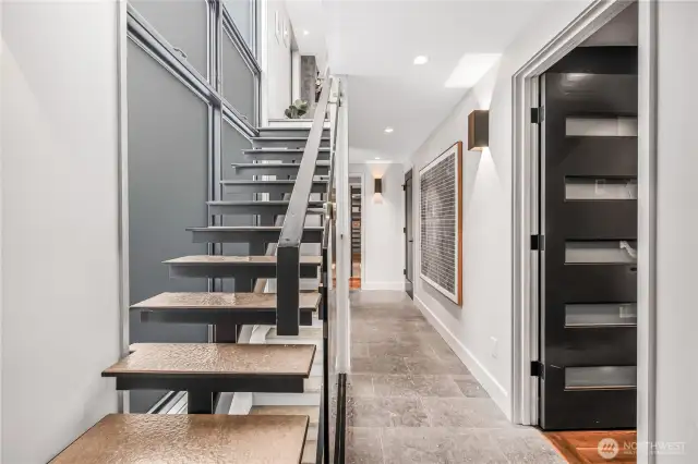 Concrete floating staircase is one of a kind with incredible fossils from Montana.