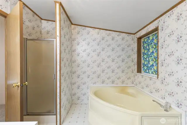 Primary bath with soaking tub and walk in shower.