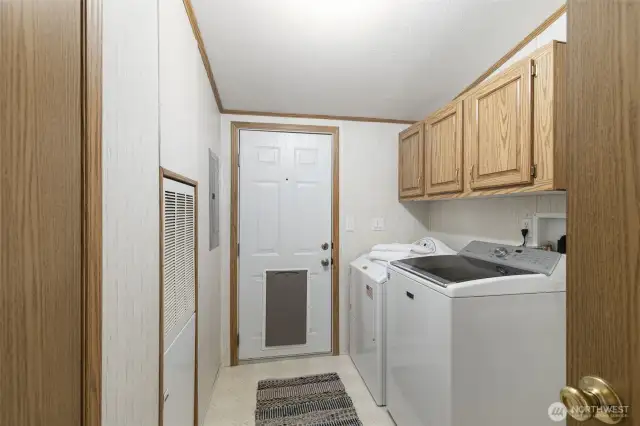 Laundry room with access to covered back deck.