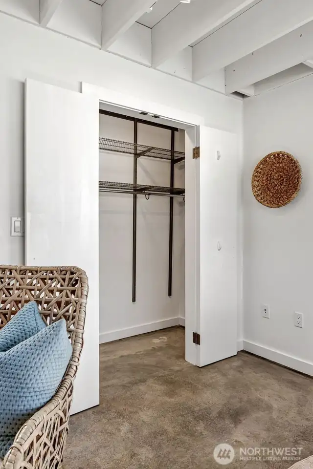 BIG storage closet has organizing system to stretch how much you can tuck away here!