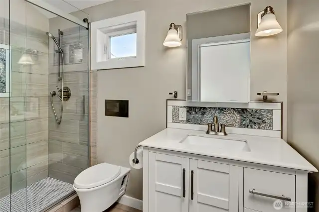 Gorgeous bathroom with designer finishes & fixture and yes-skylight!