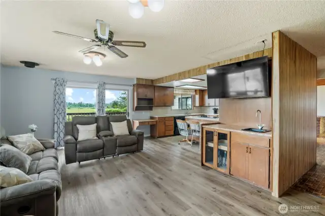 Family room open to kitchen and convenient wet bar with prep sink.