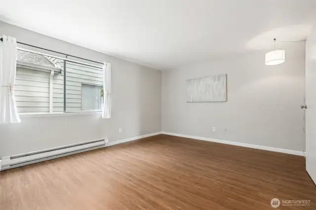 Primary Bedroom w/large window and attached 3/4 bath and walk in shower.