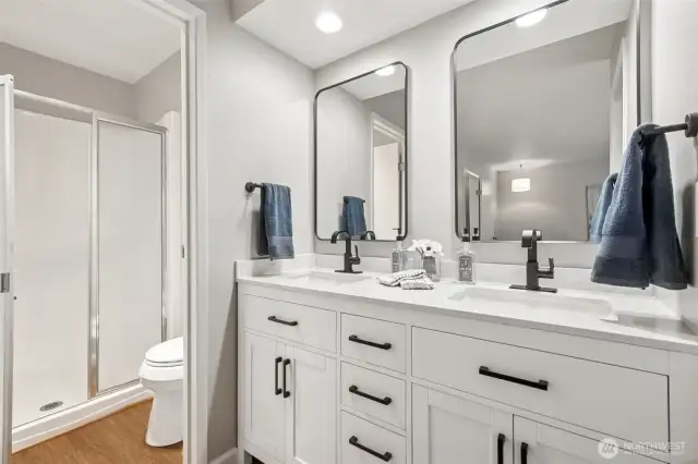 Shower and toilet are in a separate area w/door, perfect  for sharing the bathroom space.