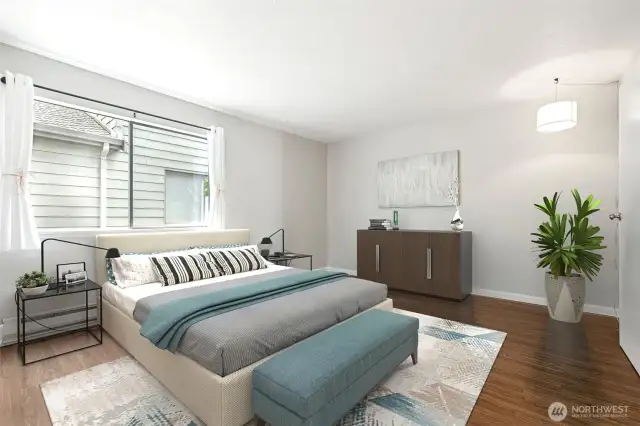 Virtually Staged! Primary Bedroom w/large window and attached 3/4 bath and walk in shower.