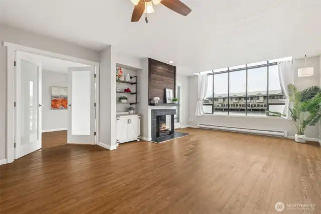 Large great room space will easily fit a dining room table and couch and living room set up! Large wall of windows at the end of the room for all the light and lake views you want!