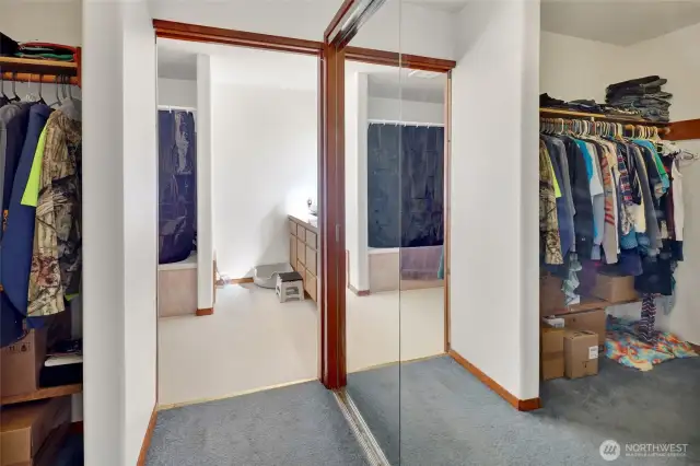 Primary bedroom walk in closet main level.
