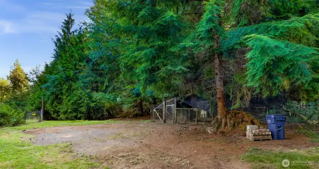 Another separate fenced area for pets or chickens