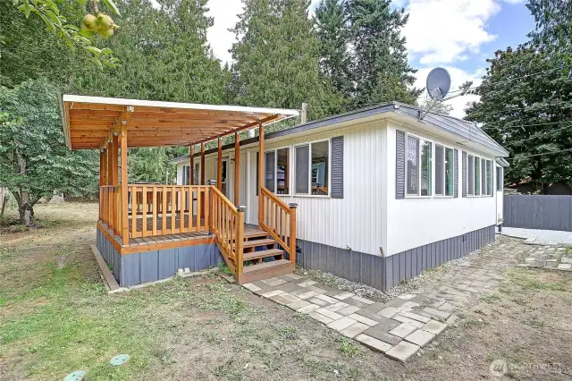 Update mobile home with large, covered deck, perfect for relaxing or entertaining year-round!