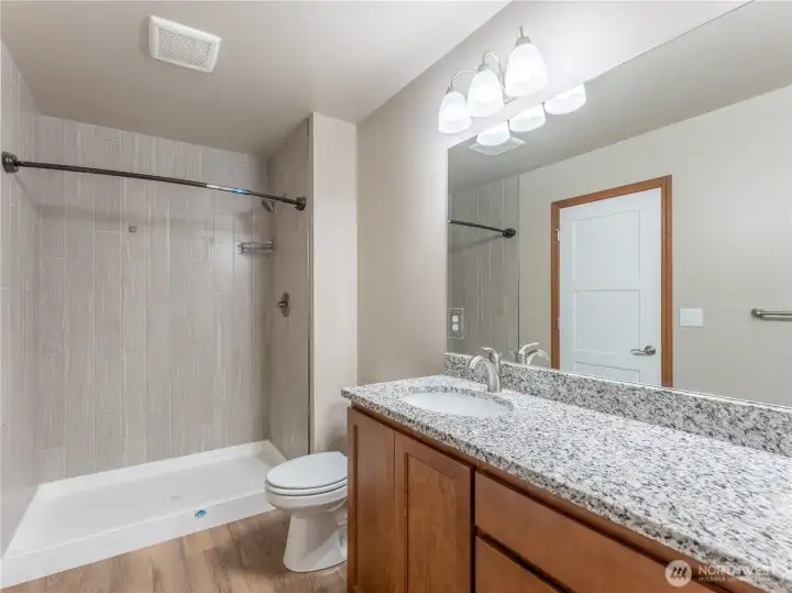 Tiled shower and granite countertops