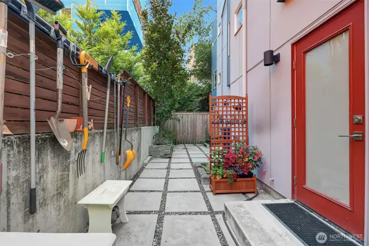 Accessed from the kitchen, this patio offers space for container gardening and a bistro table.