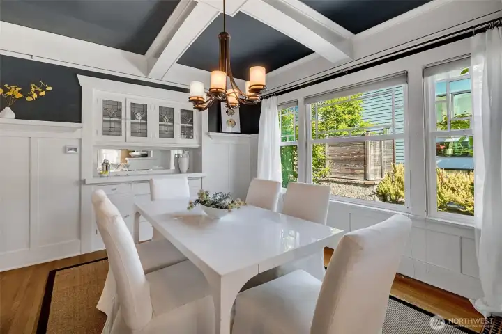 All new double pane windows in the Craftsman aesthetic, original leaded-glass Tulip themed built-ins, box-beamed ceilings, and classic wainscot.