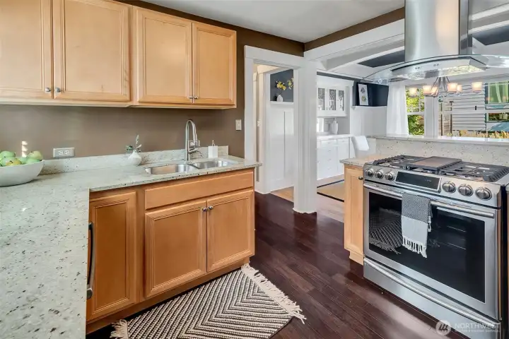 Updated kitchen with stainless steel appliances, stone counter-tops, and plenty of cabinet and counter space.