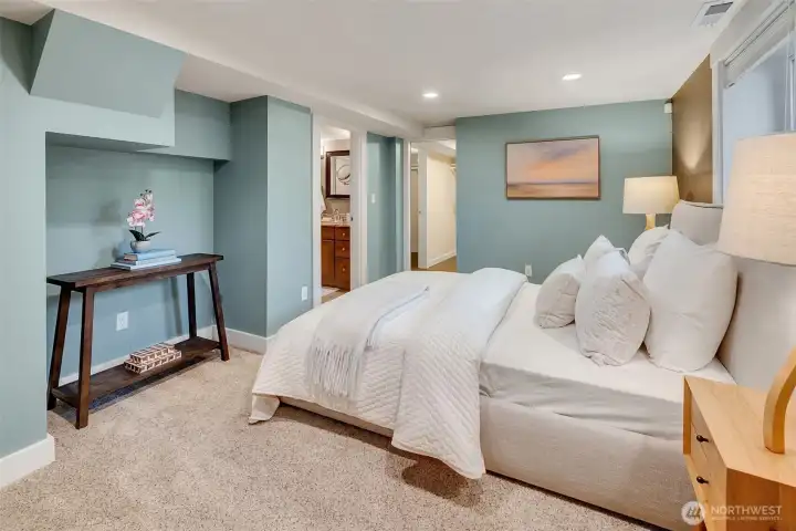 Primary bedroom with ensuite bath and two large walk-in closets.