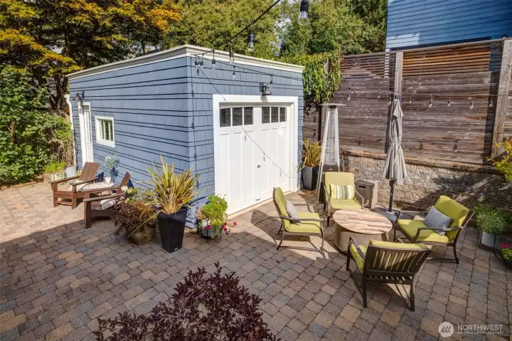 Roll up the door and find the FUN entertaining hub. Beautiful paver patio for hosting BBQs or game days.
