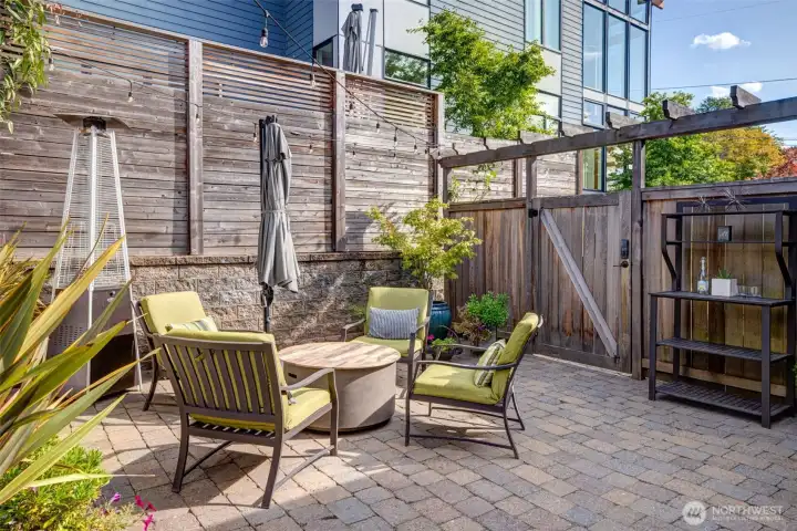 Designed for comfort and ease of entertaining at the bar. The fire pit enhances the backyard ambiance, making it a great spot to dine al fresco.