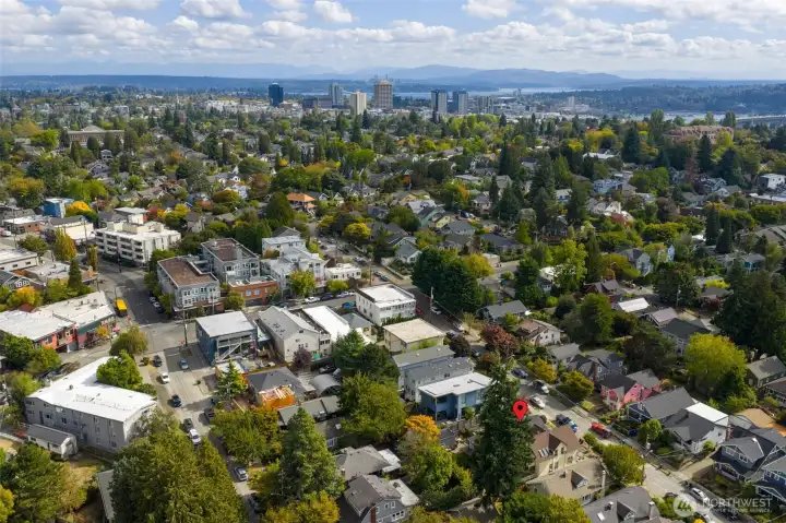 Aerial image looking east. The tall buildings are near the University of Washington, with Lake Washington in the background (Redmond and Bellevue are across the water). On a sunny day, you would see the Cascade mountain range.