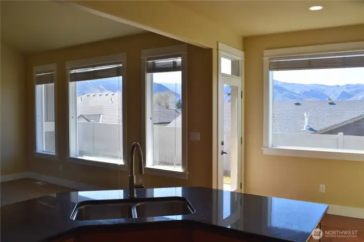 View from Kitchen out to backyard and views