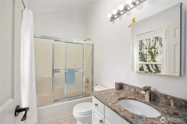 En suite full bath off of 2nd bedroom