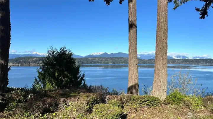 Everywhere you turn, the scenery delivers... with beautiful water and mountain views stretching across the entire front of the property.