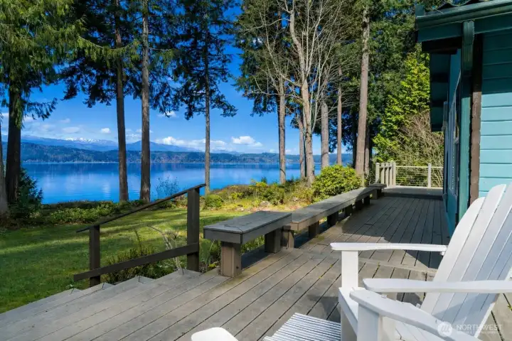 The deck runs the entire length of the front of the home... an inviting extension of the living space and such a wonderful place to soak in the views.