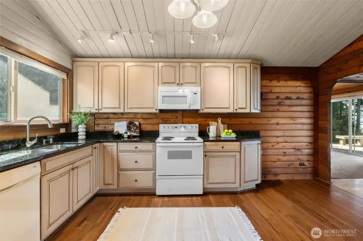 With newer cabinetry, pull-outs, and slab granite, this recently remodeled kitchen offers the kind of thoughtful updates that make everyday living feel both easy and comfortable.