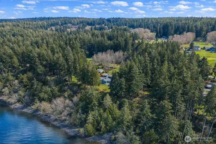 150 feet of high-bank waterfront... and the kind of setting that makes home feel less like an address and more like a destination you never want to leave.