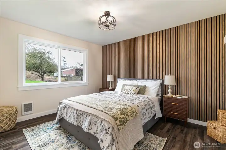 The second bedroom is also nicely sized. Queen sized bed with storage drawers for size reference.