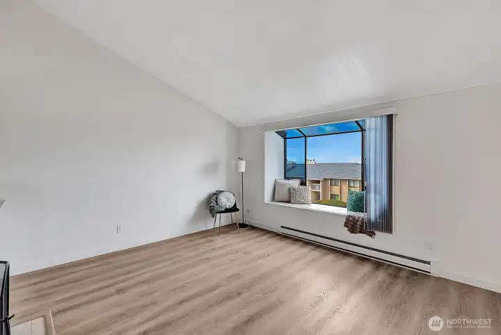 Bay window has a cozy seating area