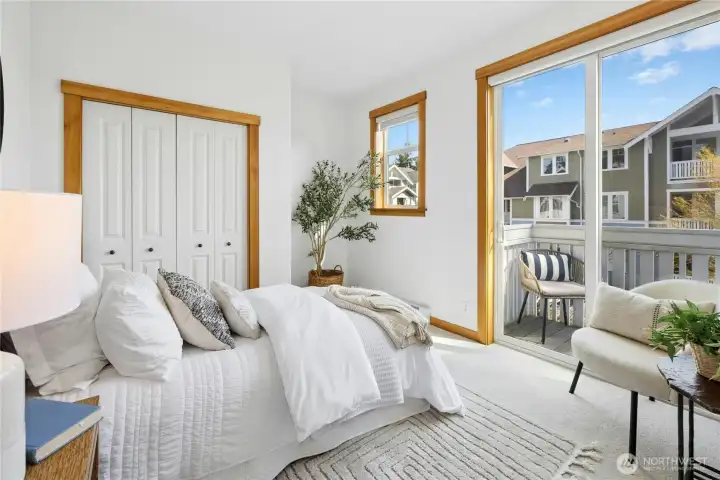 Main floor bedroom with balcony.