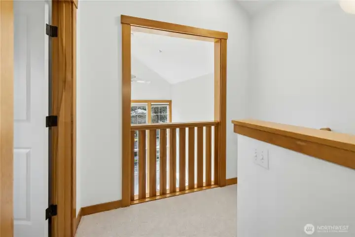 Upstairs landing overlooks the living room.