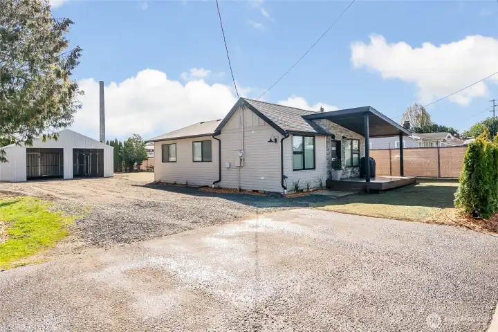 Unique opportunity with a stylishly updated home, large carport, and spacious lot.