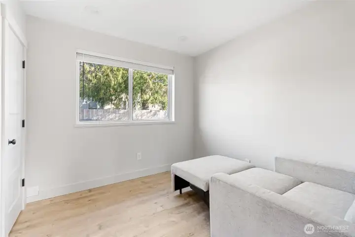 Spacious Bedroom that has plenty of natural light.