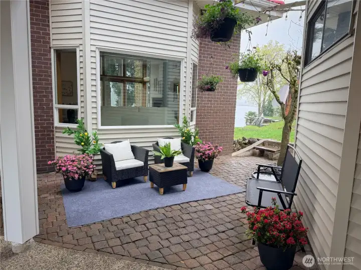 Inviting courtyard welcomes you and your guests with grape vines, a view of the lake, and your very own pond