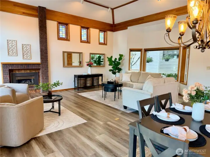 Vaulted ceilings & walls of windows flood the home with natural light & stunning lake views