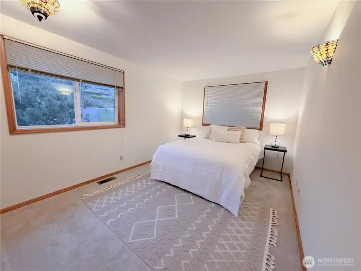 The second bedroom on the main floor is larger than most