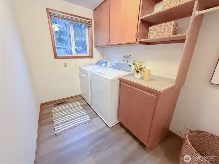 Laundry room on the main floor with lots of storage space