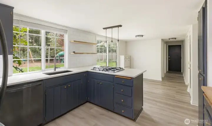 Kitchen looking over the breakfast bar into the eating space.