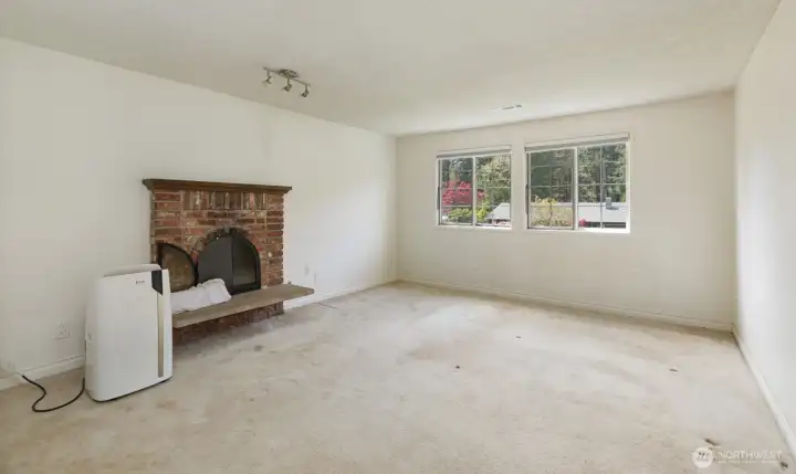 Primary bedroom has a wood fireplace