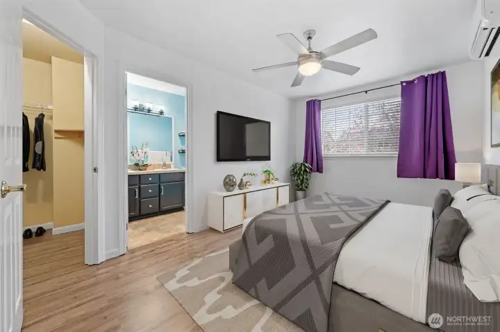 The upper level has a spacious primary bedroom with an ensuite bathroom and closet. A separate mini-split in the bedroom allows you to adjust temperature.