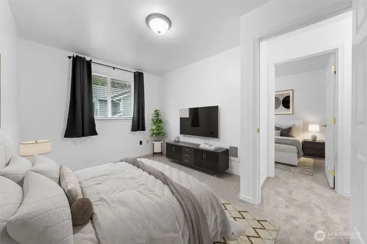 An additional upper level bedroom benefits from comfortable carpeting, newly installed.